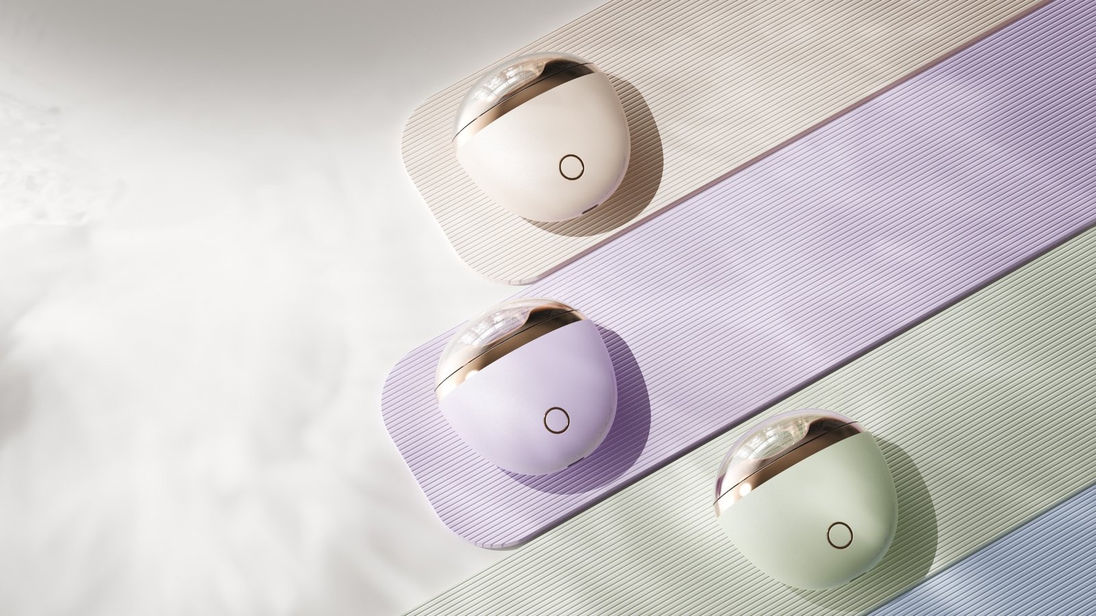 Three Mousse electric nail clipper color variants in a soft lifestyle arrangement