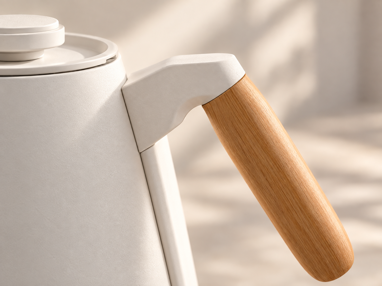 Close-up of the matte kettle body and natural beech handle